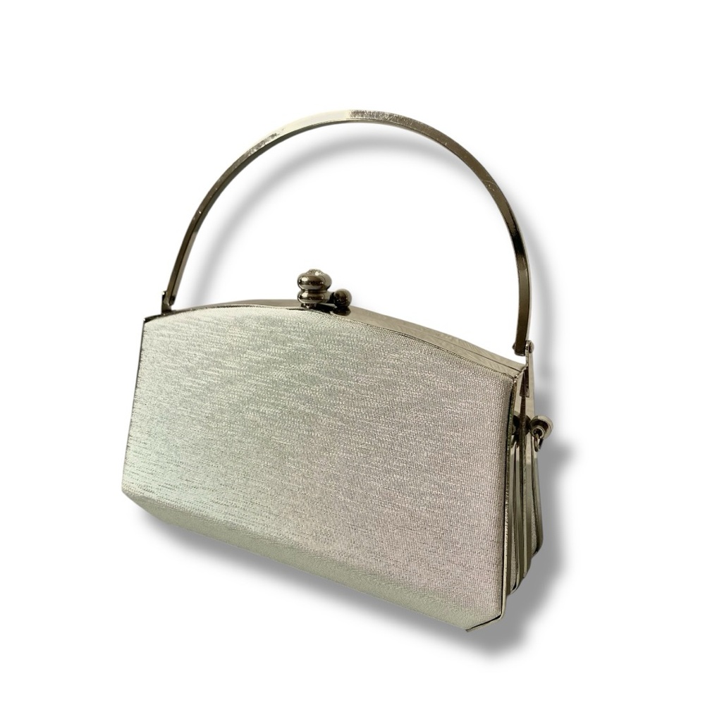 Sleek Silver Clutch with Structured Design and Metal Handle